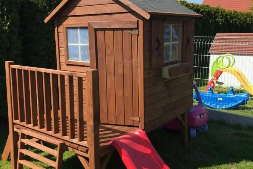Half of holiday home, terrace, playground