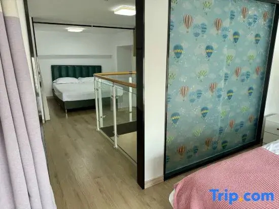 Mu'en Loft Light Luxury Apartment (Qingdao North Railway Station)