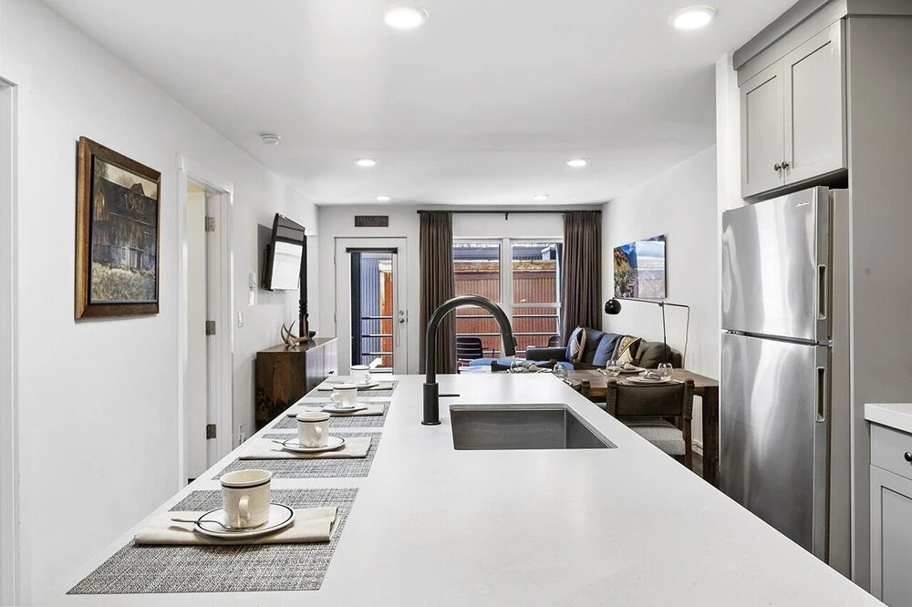 Top Floor Condo With Balcony Steps To Lifts & Main Street 2 Bedroom Condo by RedAwning