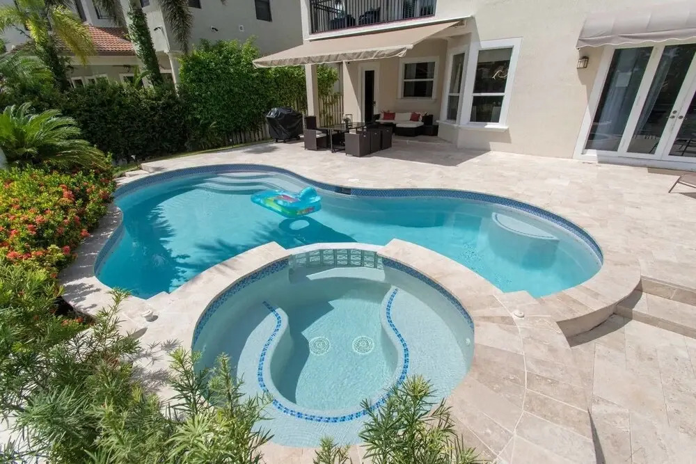 Gorgeous 5 Bedroom Home w/heated Pool Canal Front