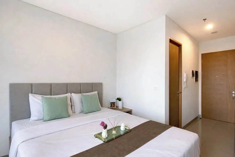Homey Wooden Touch Studio At Apartment Ciputra World 2