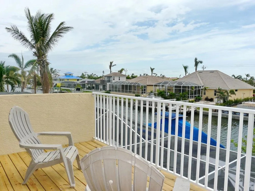Large waterfront home with all-day sun on pool