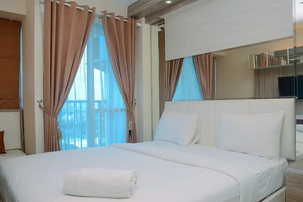 Homey and Cozy Living Studio Room at Tifolia Apartment By Travelio