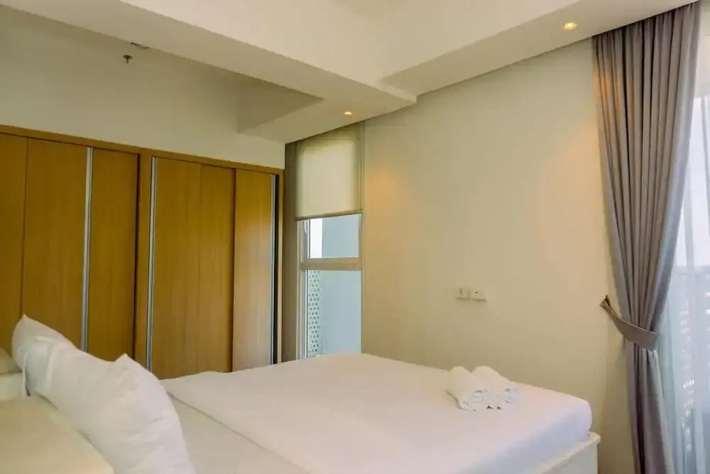 Spacious 1BR with Japandi Design at West Vista Apartment By Travelio