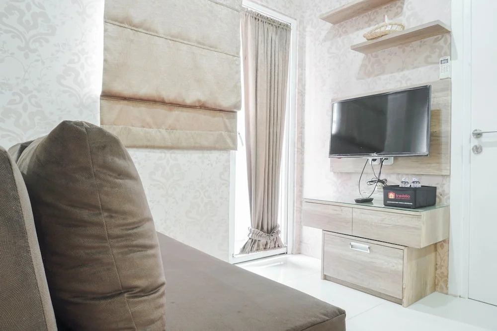 Cozy Stay at 2BR Green Pramuka Apartment near Shopping Center