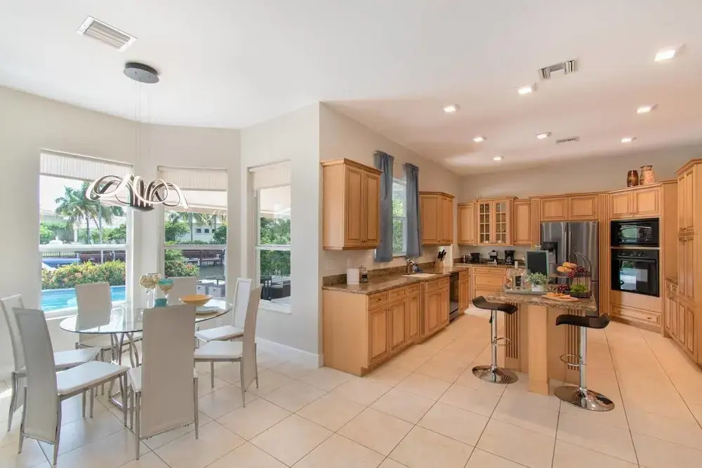 Gorgeous 5 Bedroom Home w/heated Pool Canal Front