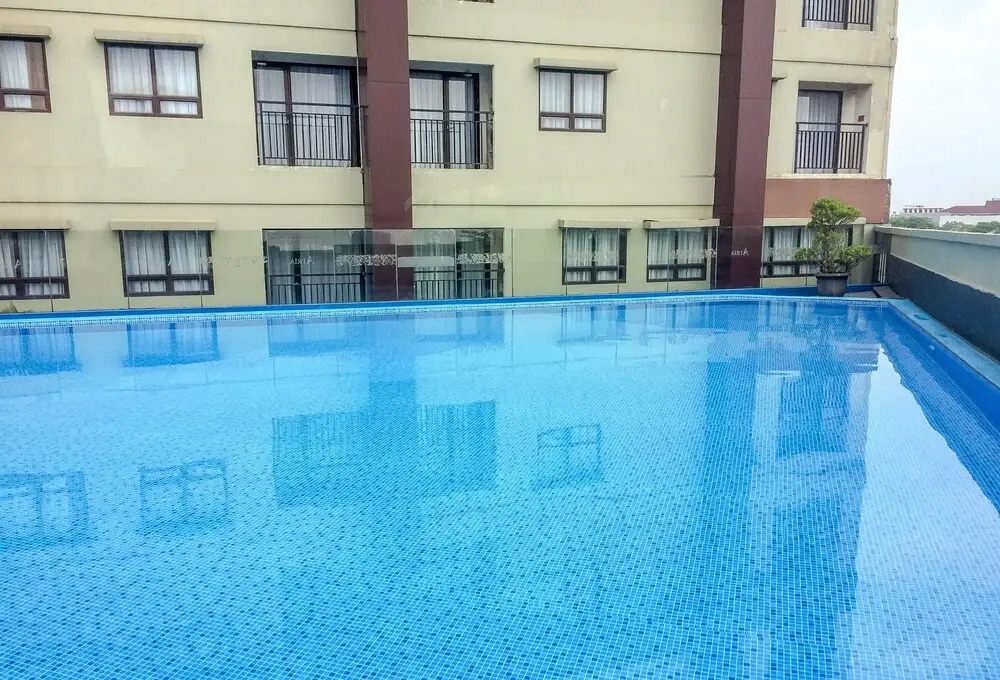 Simply Studio Room Atria Residence Apartment near Summarecon Mall By Travelio