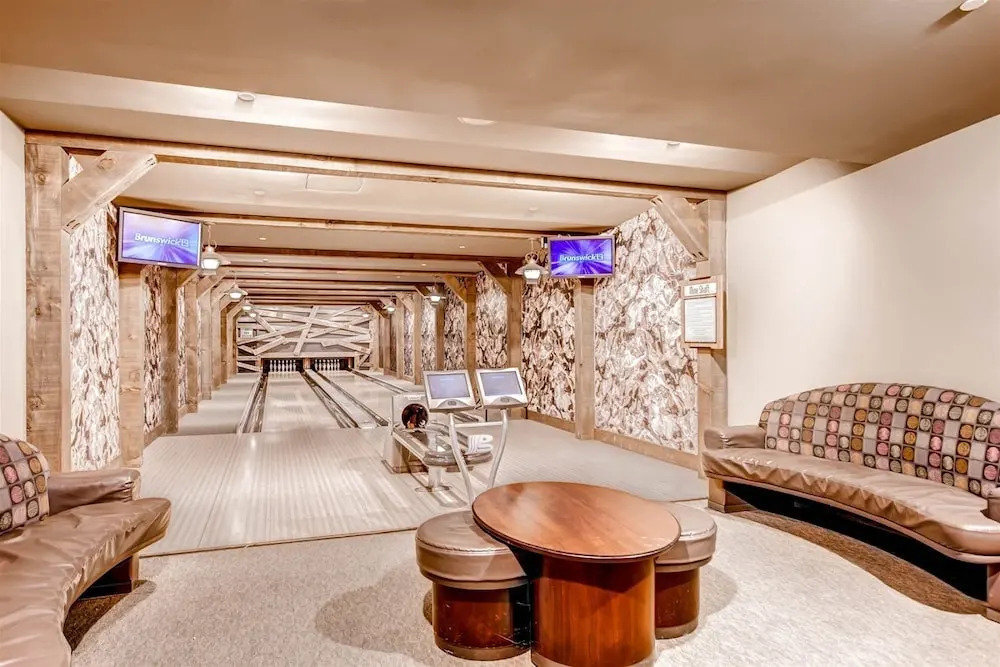Expansive 4 Bedroom Ski in, Ski out One Ski Hill Residence Located at the Base of Peak 8 with Beautiful Views