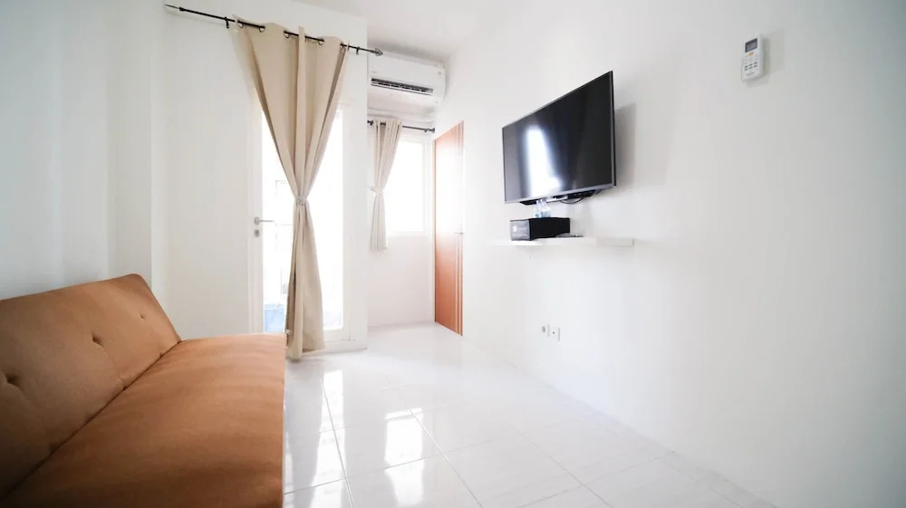 Cozy Living And Tidy 2Br At Puncak Dharmahusada Apartment