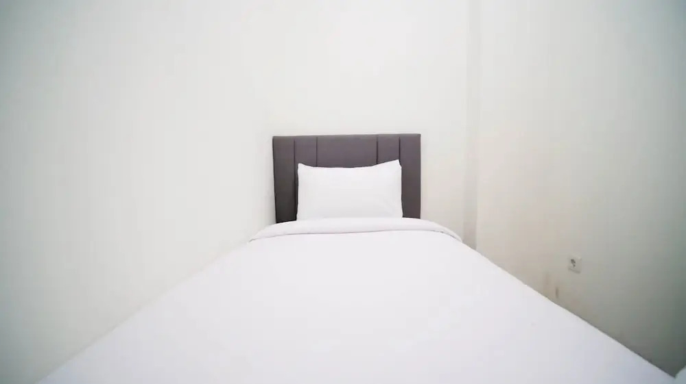 Cozy Living And Tidy 2Br At Puncak Dharmahusada Apartment