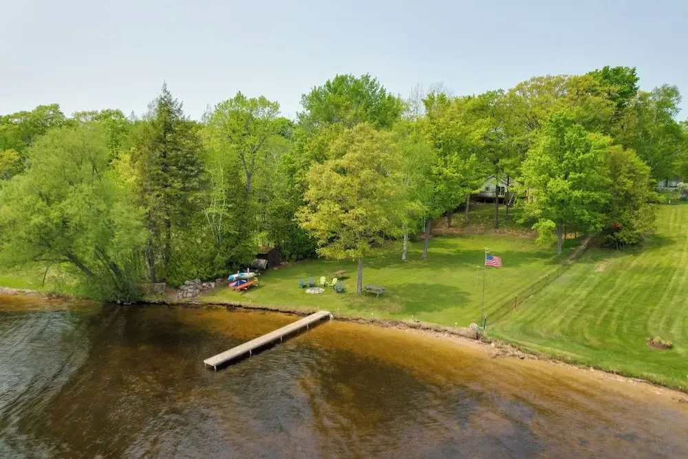 Cozy Carp Lake Cottage w/ Dock, Kayaks & Fire Pit