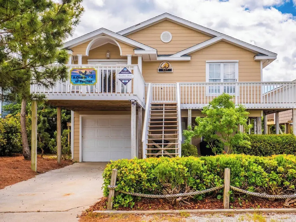 A Charm of Finches by Topsail Realty
