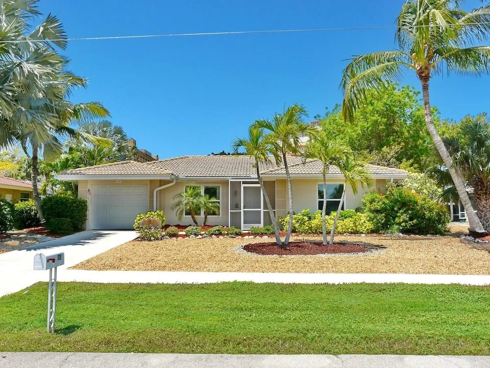 Cozy Home With Sunroom, Pool and Steps to Beach