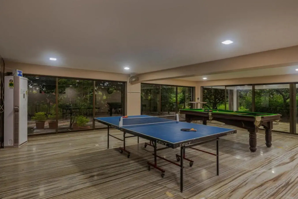 SaffronStays Aura, 4 BR Luxury Pool Villa with Game Room & Lawn