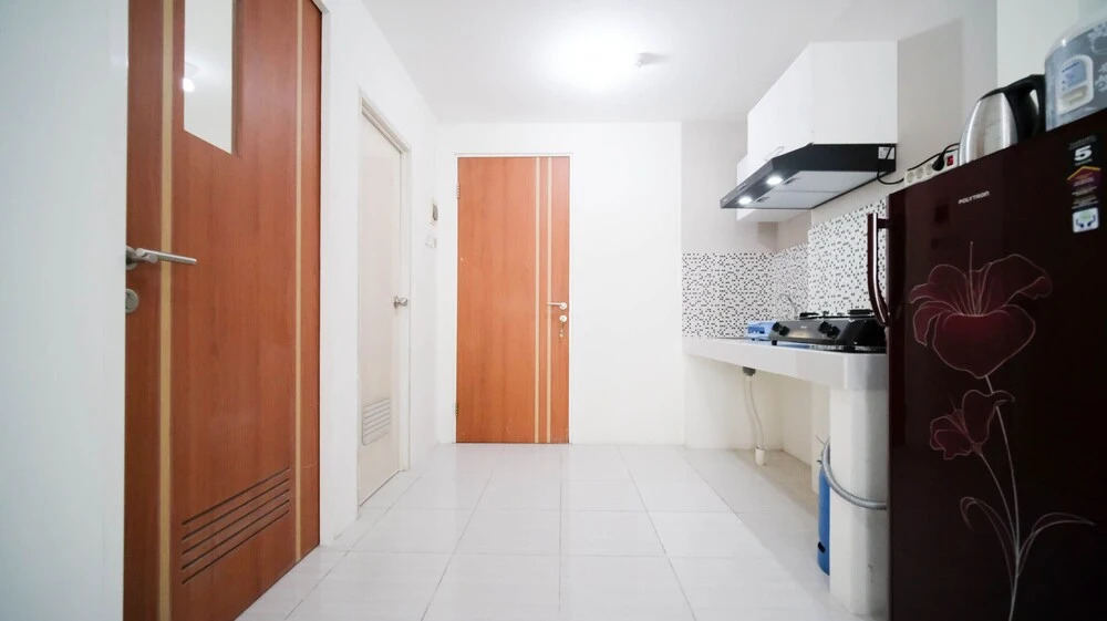Cozy Living And Tidy 2Br At Puncak Dharmahusada Apartment
