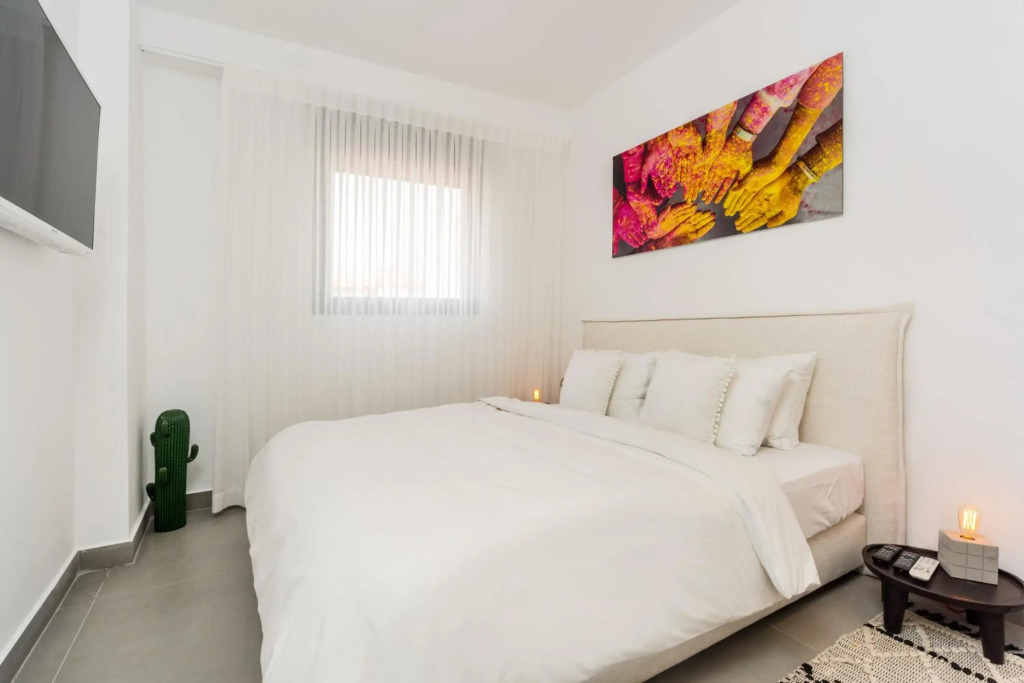 Walk to Beaches from an Arty New-Build Apartment