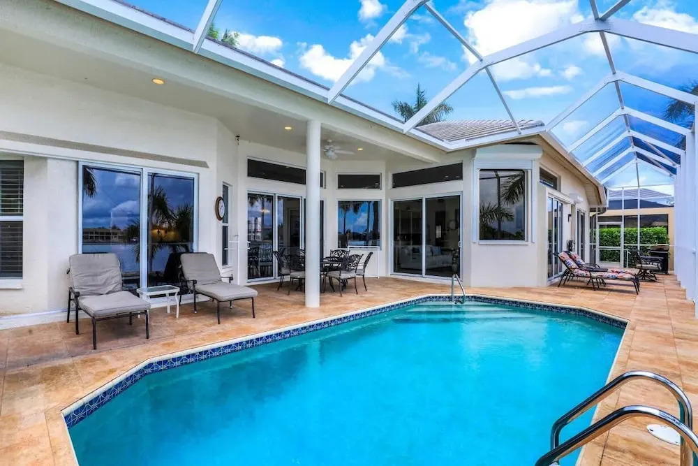 Waterfront home with views, pool and walk to beach