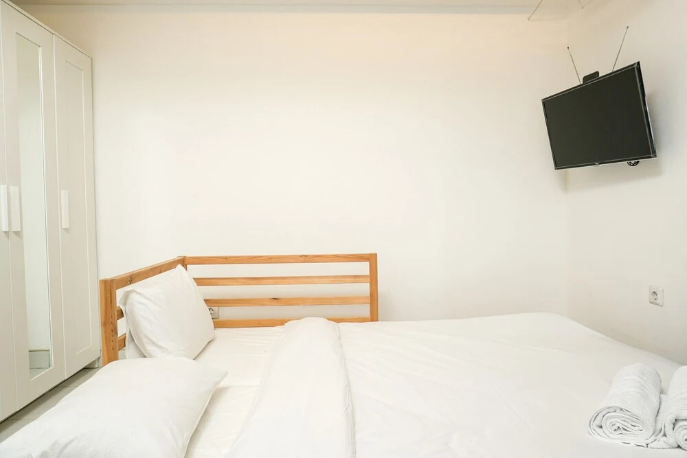 Simply White and Compact Studio at Amethyst Apartment