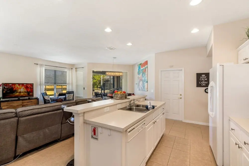Extended Sunny Pool Deck with Pool and Spa and Lake View in Gated Solterra Resort