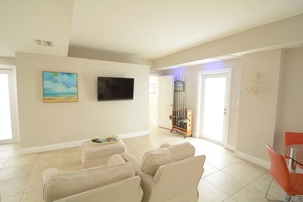 Beautiful Canal Front Home With Above Ground Pool, Dock And Fish Cleaning Station 4 Bedroom Home by RedAwning