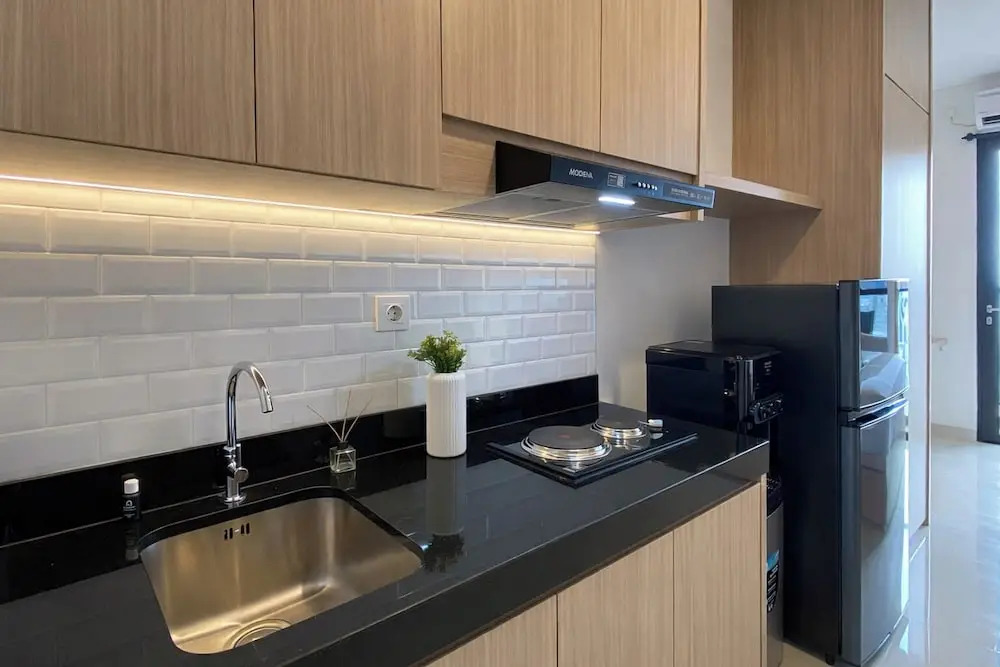 Homey Wooden Touch Studio At Apartment Ciputra World 2
