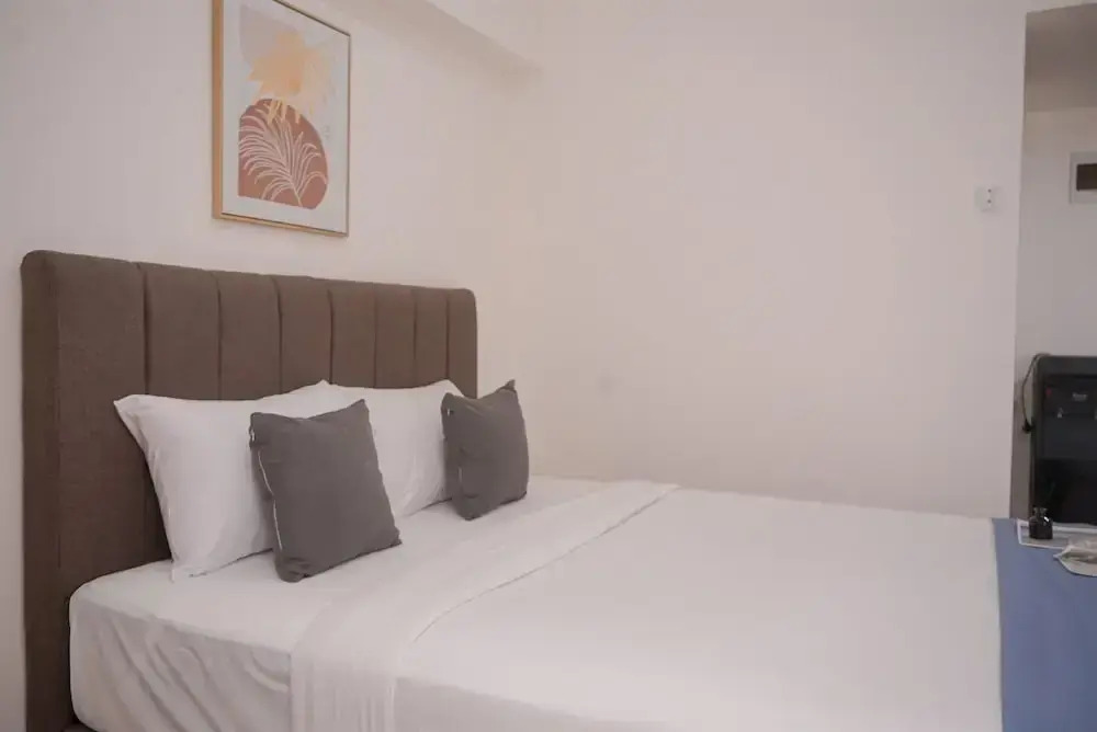 Minimalist And Warm Studio Room At Cisauk Point Apartment