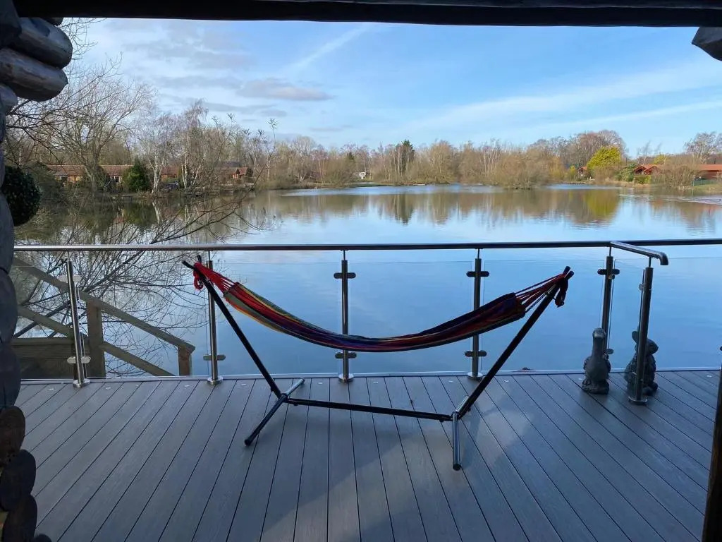 Woodpecker Log Cabin with hot tub, pizza oven bbq entertainment area, lakeside with private fishing peg situated at Tattershall Lakes