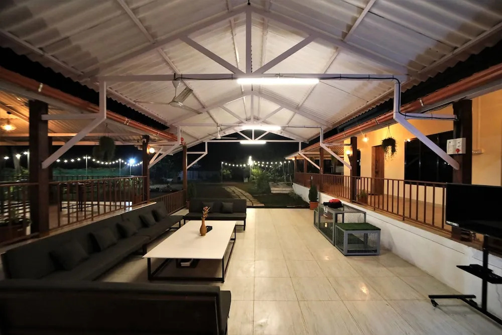 Whispering Palms by StayVista - Pool-view villa with Boutique interiors, Terrace & Lawn