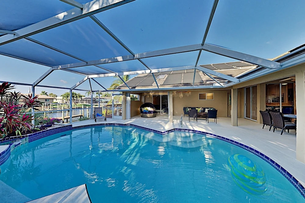 Canal-front W/ Boat Dock & Screened Pool 4 Bedroom Home
