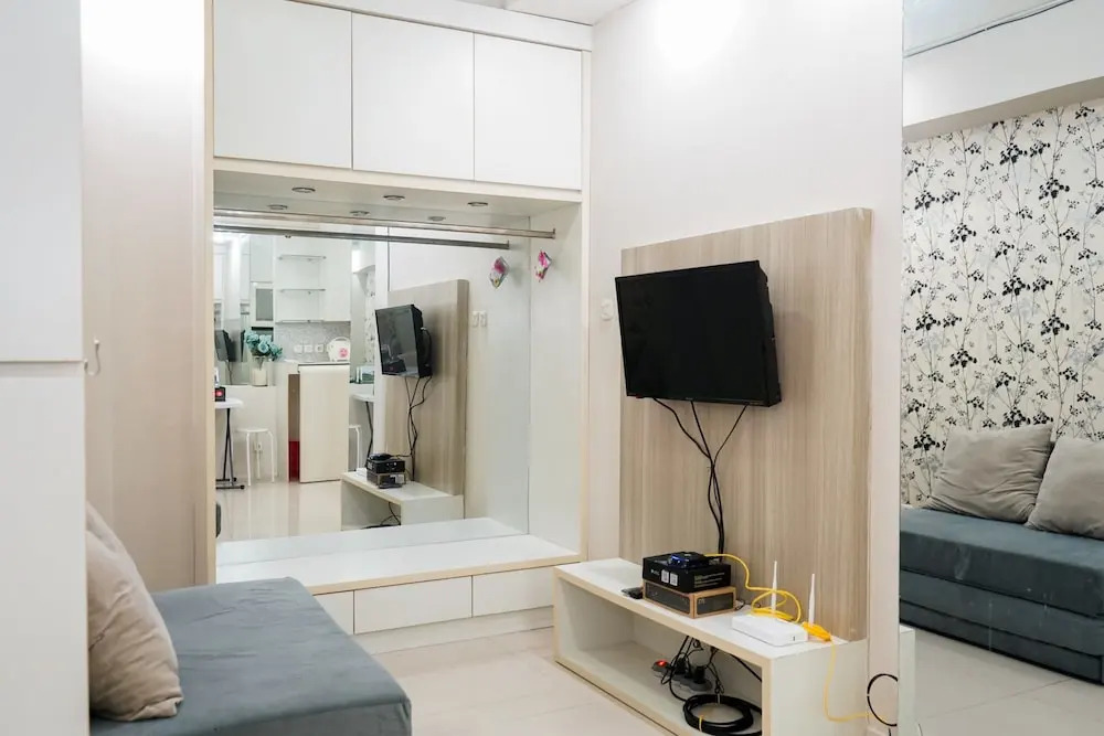 Homey 1BR with City View at Green Pramuka Apartment By Travelio
