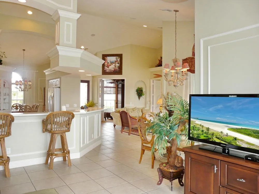 Large waterfront home with all-day sun on pool