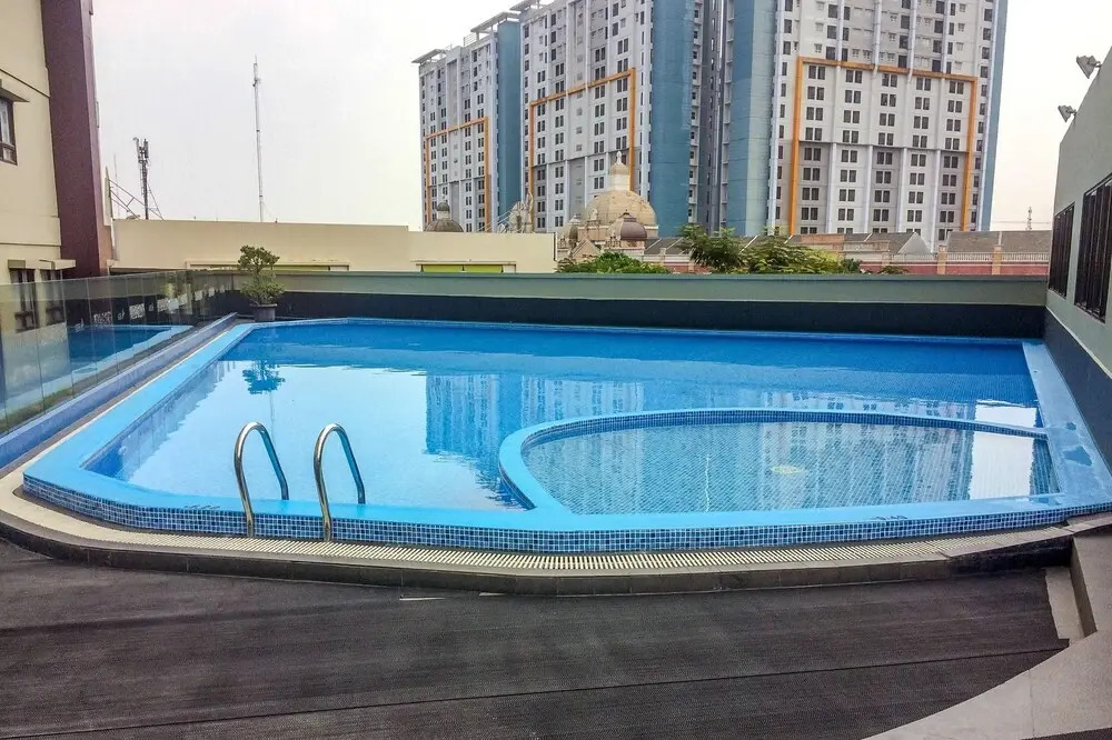 Simply Studio Room Atria Residence Apartment near Summarecon Mall By Travelio