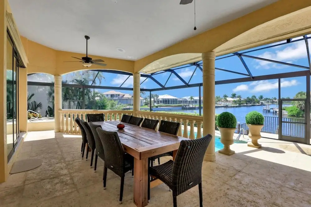 Serene waterfront home with pool, spa, and water view