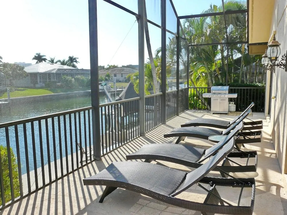 Serene waterfront home with pool, spa, and water view