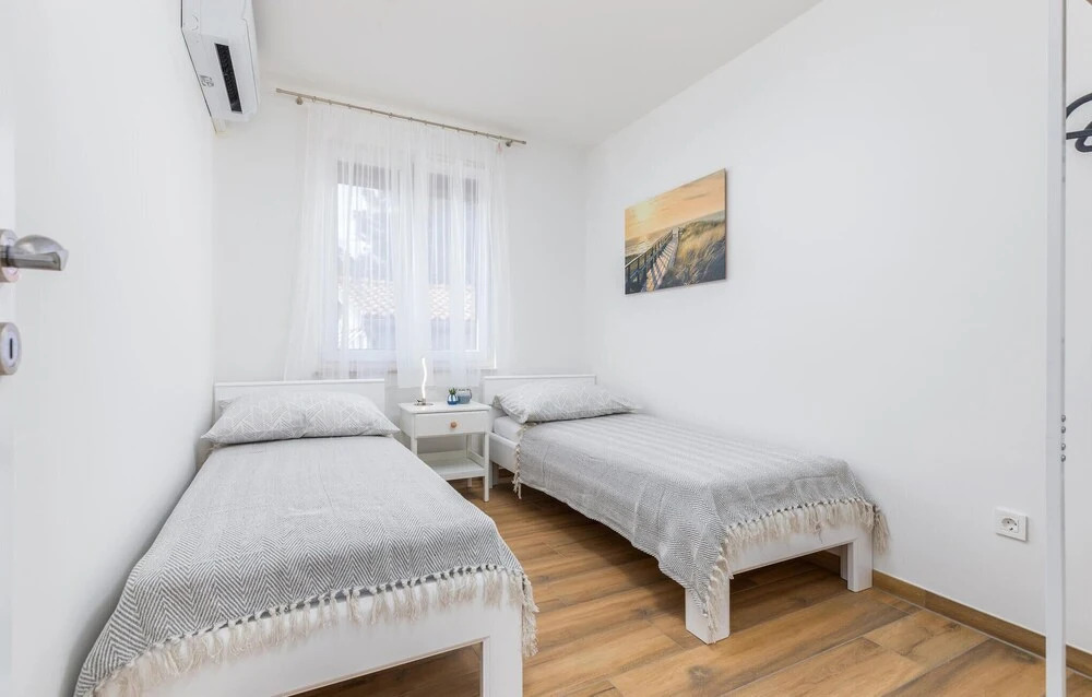 Nice Home in Peroj With Outdoor Swimming Pool, Wifi and 2 Bedrooms