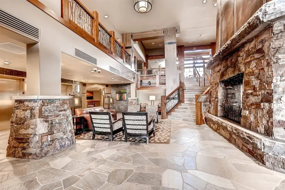 Expansive 4 Bedroom Ski in, Ski out One Ski Hill Residence Located at the Base of Peak 8 with Beautiful Views