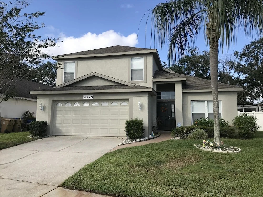 3 Bedroom Home With Private Screened Pool With Rock Waterfall Feature and Gameroom by Florida Dream Homes