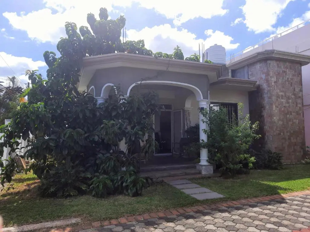 Cardamon Villa is a 2 bedroom with 1 bathroom and seperate toilet detached house with AC and swimming pool , 5 minutes walk from Flic en Flac public beach