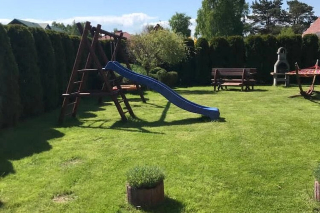 Half of holiday home, terrace, playground