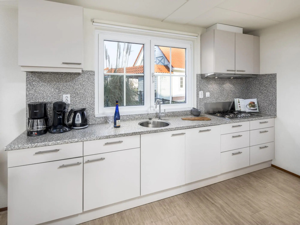 Restyled villa with sauna and rowing boat, in a holiday park, 400 m from the sea