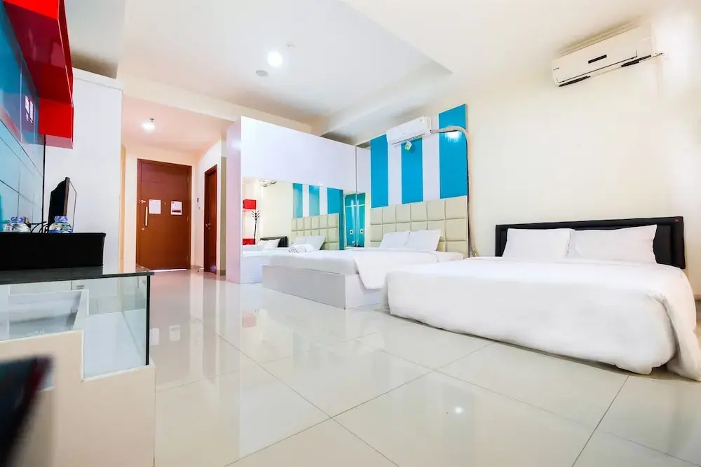 Family Studio Room at Ancol Mansion Apartment By Travelio