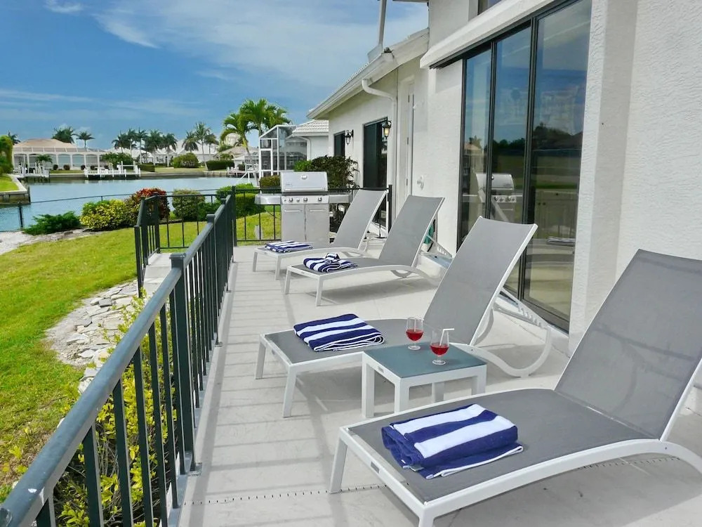 Waterfront home on key lot with pool, spa and views
