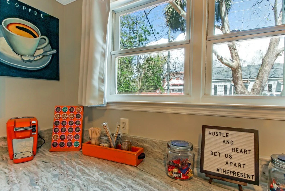 Vibrant, Colorful Condo Building With Backyard Firepit and Games