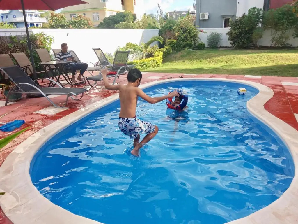 Cardamon Villa is a 2 bedroom with 1 bathroom and seperate toilet detached house with AC and swimming pool , 5 minutes walk from Flic en Flac public beach