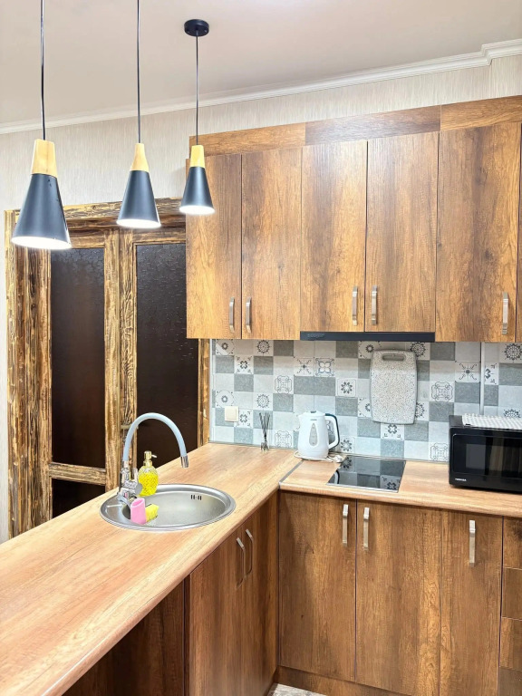 Апартаменты Two-bedroom family apartment for four guests with one large bed and two sofa beds