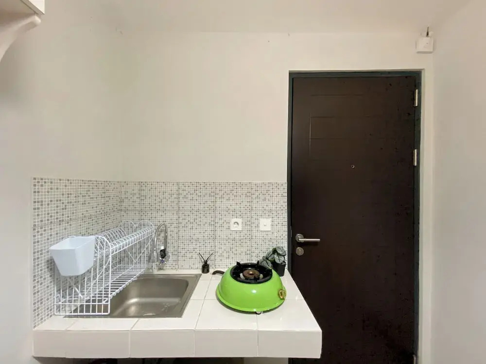 Minimalist And Cozy 1BR at Royal Heights Apartment