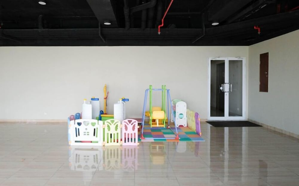 Wood Accents Studio At Grand Dharmahusada Lagoon Apartment
