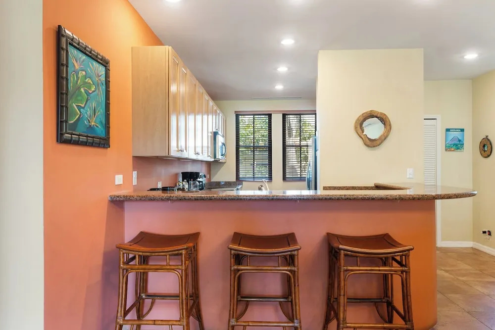 Luxe! Impressively designed 2nd-floor unit in Coco done in red and orange hues