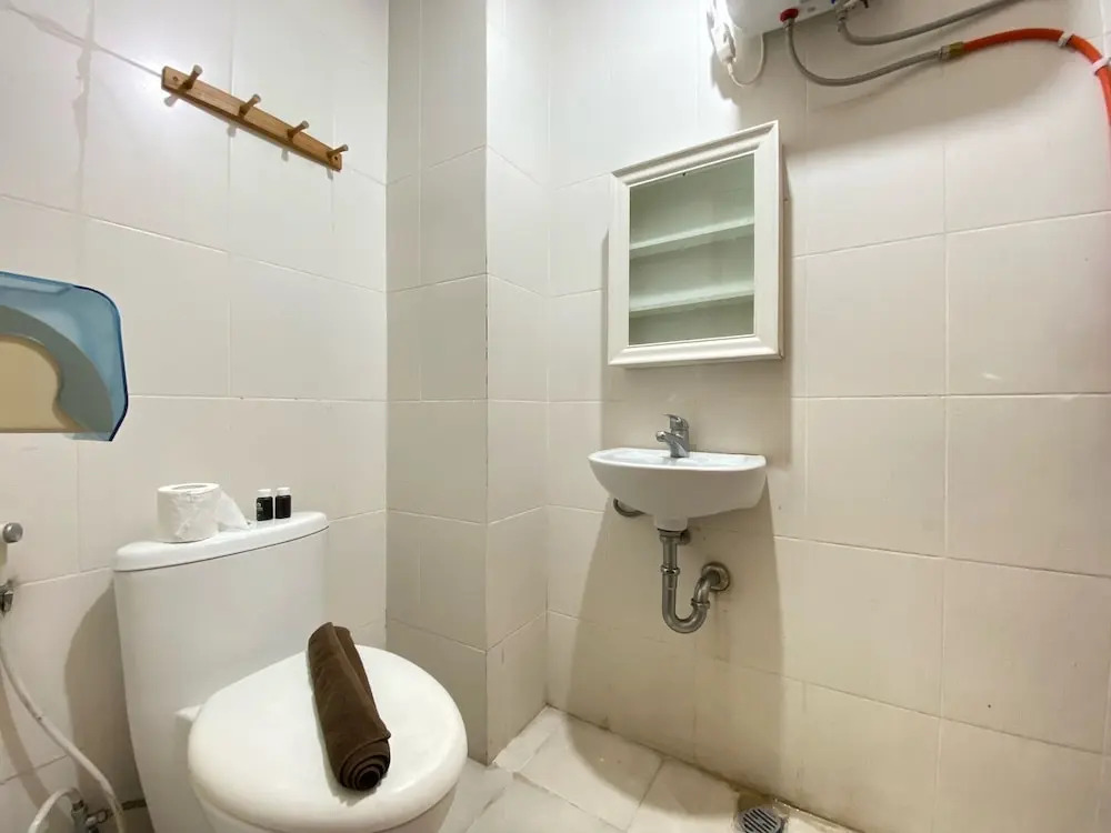 Cozy 2BR at Pinewood Apartment By Travelio