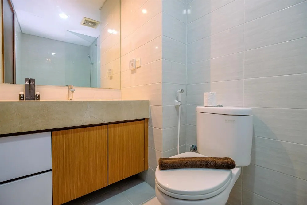 Cozy Living and Spacious Studio at 28th Floor Kemang Village Apartment By Travelio